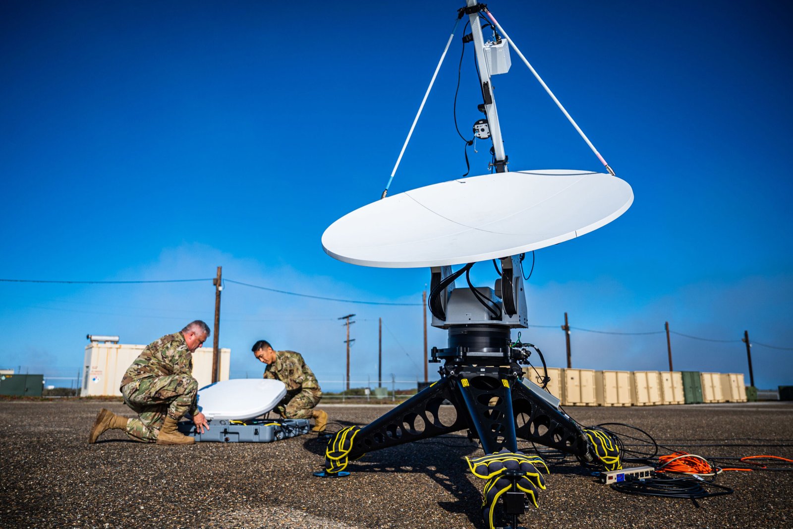 Two members of the 216th Space Control Squadron (SPCS) set up antennas as part of a ‘Honey Badger System’ during BLACK SKIES 22 at Vandenberg Space Force Base, Calif., Sept. 20, 2022. The 216 SPCS specializes in electromagnetic warfare and is participating in the Space Training and Readiness Command’s (STARCOM) BLACK SKIES 22, along with numerous other units spanning from California to Colorado. The first of its kind, BLACK SKIES 22 is a live simulation exercise designed to rehearse the command and control of multiple joint electronic warfare fires. (U.S. Space Force photo by Tech. Sgt. Luke Kitterman)